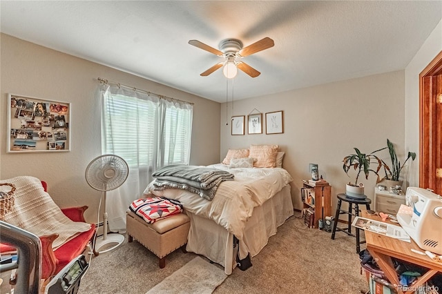 2408 N 7th St Unit A, Colorado Springs, CO 80907 - bedroom with light carpet, a ceiling fan, and baseboard heating