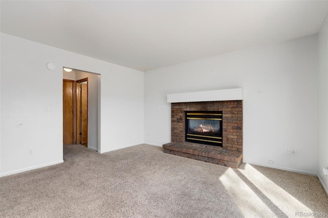 unfurnished living room with a brick fireplace and light carpet