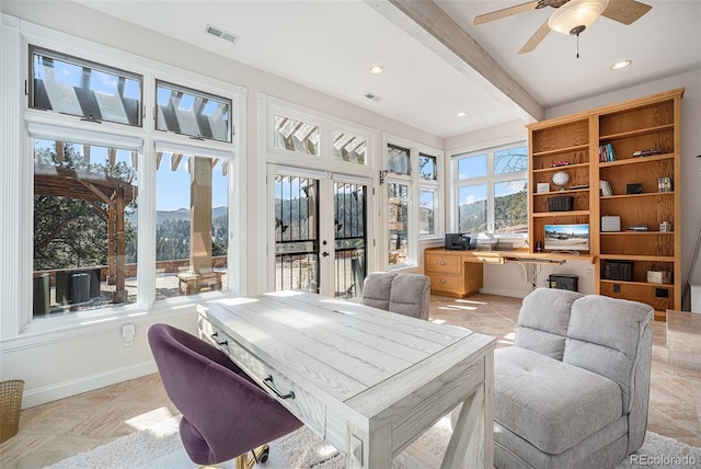 home office featuring ceiling fan, beamed ceiling, a mountain view, and french doors