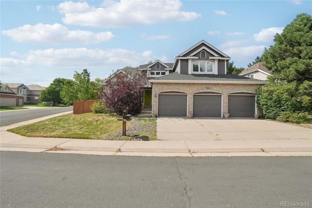 5564 S Jasper Way, Centennial, CO 80015 - view of front facade with driveway, a garage, brick siding, and roof with shingles