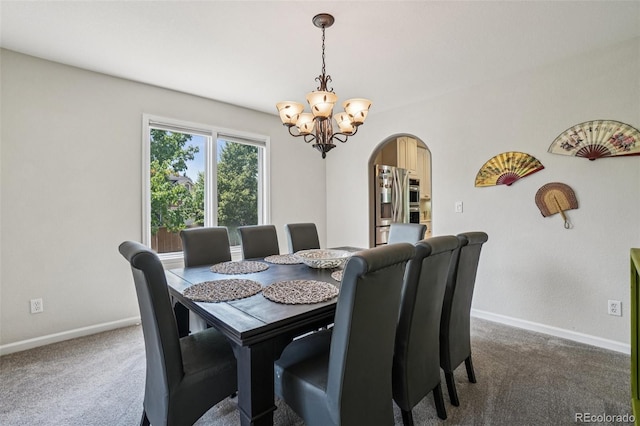 5564 S Jasper Way, Centennial, CO 80015 - carpeted dining room with arched walkways and a chandelier