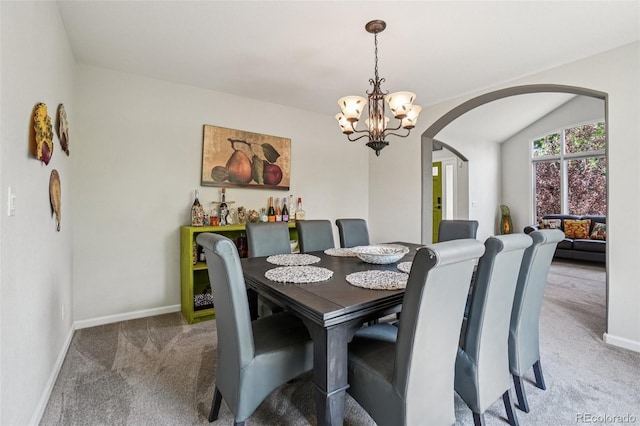 5564 S Jasper Way, Centennial, CO 80015 - dining area with arched walkways, carpet floors, and a chandelier