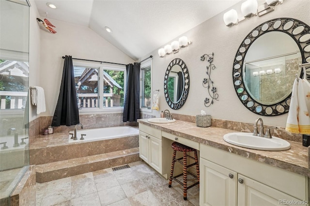 5564 S Jasper Way, Centennial, CO 80015 - bathroom with lofted ceiling, double vanity, a garden tub, and recessed lighting