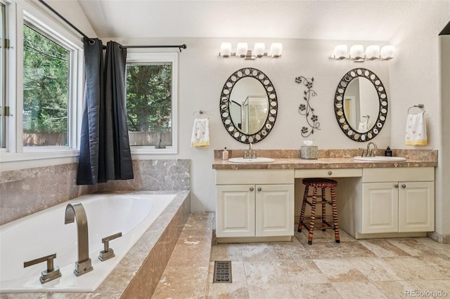 5564 S Jasper Way, Centennial, CO 80015 - bathroom with double vanity, a garden tub, and lofted ceiling