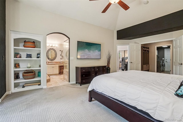 5564 S Jasper Way, Centennial, CO 80015 - bedroom with carpet flooring, vaulted ceiling, ensuite bathroom, and a ceiling fan