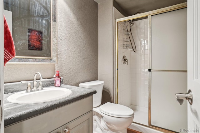 5564 S Jasper Way, Centennial, CO 80015 - full bathroom with a textured wall, a stall shower, and vanity