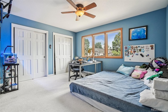 5564 S Jasper Way, Centennial, CO 80015 - bedroom featuring multiple closets, carpet floors, and a ceiling fan