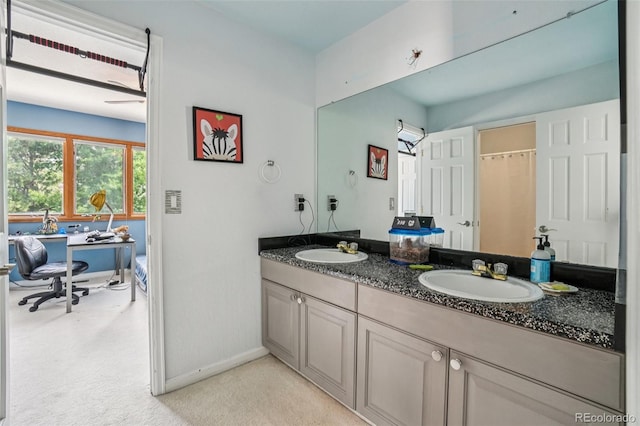 5564 S Jasper Way, Centennial, CO 80015 - full bathroom with double vanity and baseboards