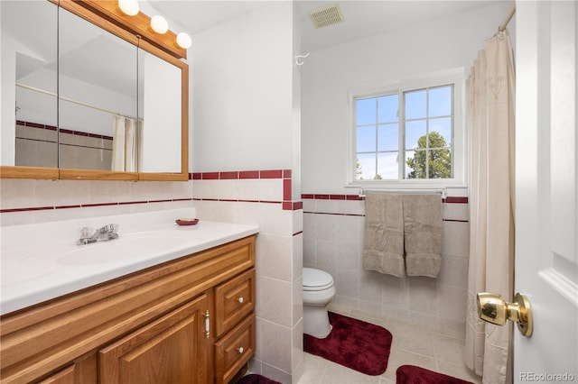 266 Gap Rd, Black Hawk, CO 80422 - bathroom featuring tile walls, vanity, wainscoting, tile patterned floors, and a shower with shower curtain