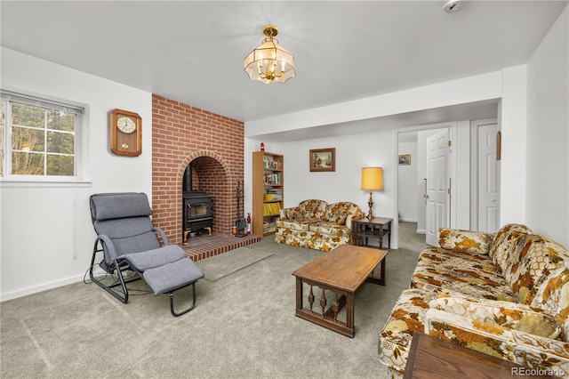 266 Gap Rd, Black Hawk, CO 80422 - carpeted living room featuring a wood stove and a chandelier