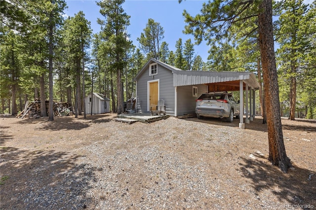 266 Gap Rd, Black Hawk, CO 80422 - view of shed with dirt driveway and an attached carport