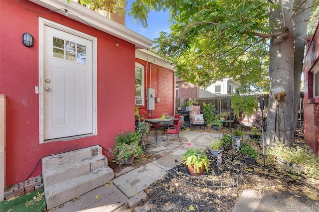 property entrance with a patio