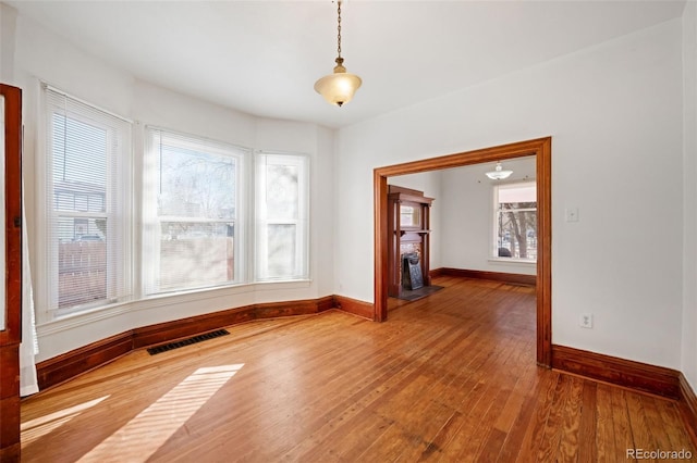 empty room with hardwood / wood-style flooring