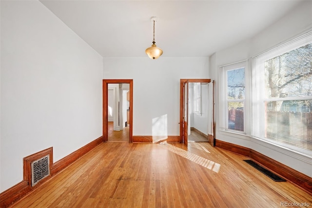 unfurnished room featuring light hardwood / wood-style floors