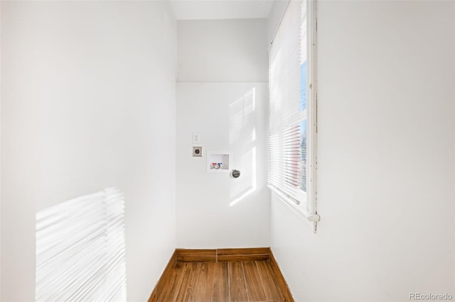 washroom featuring wood-type flooring, hookup for a washing machine, and hookup for an electric dryer