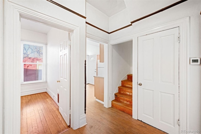 corridor with light wood-type flooring