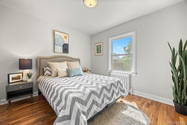 2616 Utica St, Denver, CO 80212 - bedroom with radiator, baseboards, and wood finished floors