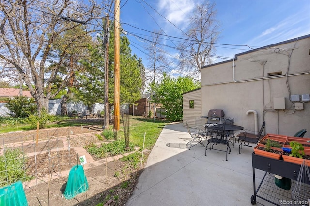 2616 Utica St, Denver, CO 80212 - view of patio with outdoor dining area and a garden