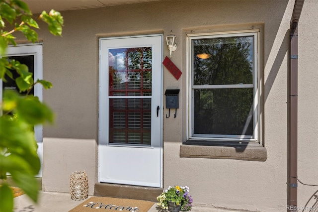2616 Utica St, Denver, CO 80212 - doorway to property with stucco siding