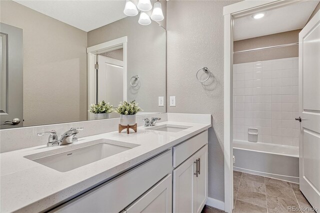 full bath with shower / washtub combination, a sink, toilet, and double vanity