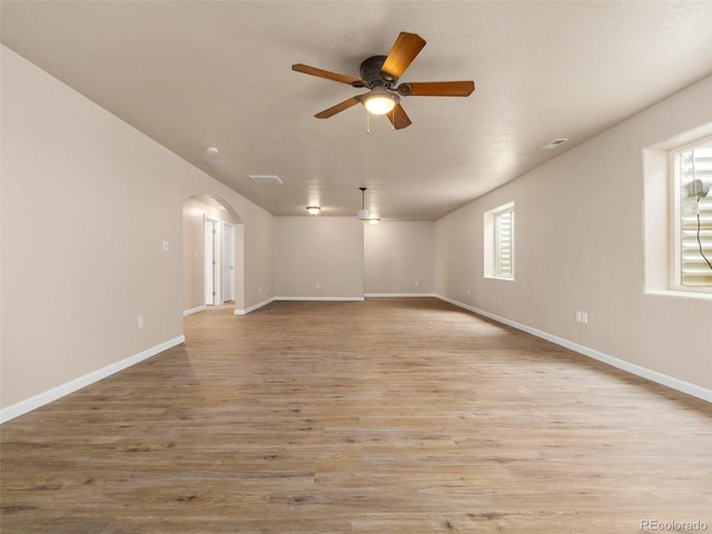 empty room featuring light hardwood / wood-style flooring and ceiling fan