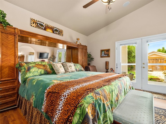 bedroom with access to exterior, french doors, vaulted ceiling, ceiling fan, and hardwood / wood-style flooring