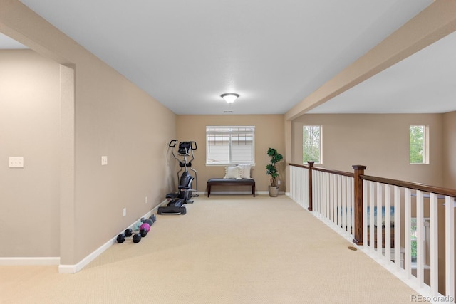exercise area with carpet and baseboards