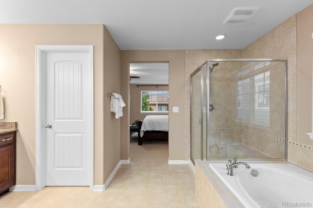 ensuite bathroom featuring a stall shower, a bath, vanity, baseboards, and recessed lighting