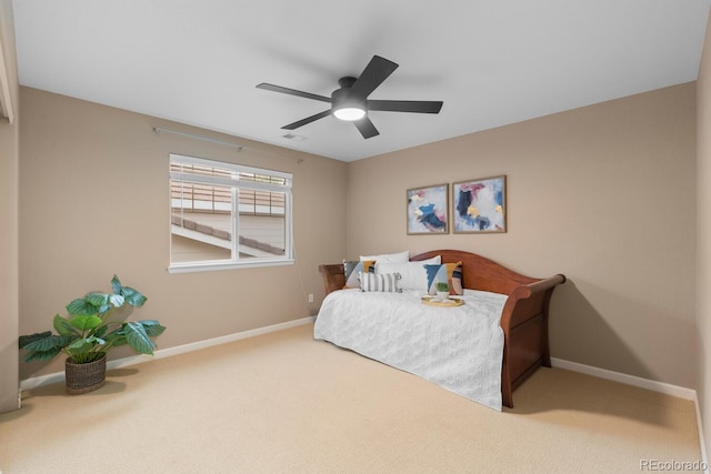 bedroom featuring carpet flooring, baseboards, and a ceiling fan