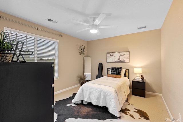 bedroom with carpet flooring, baseboards, and ceiling fan