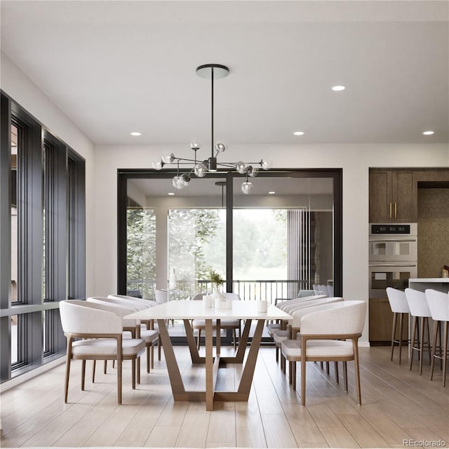 dining room with a healthy amount of sunlight and light hardwood / wood-style flooring