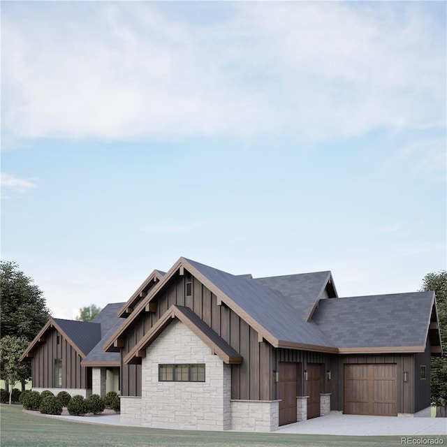 view of front of home featuring a front yard and a garage