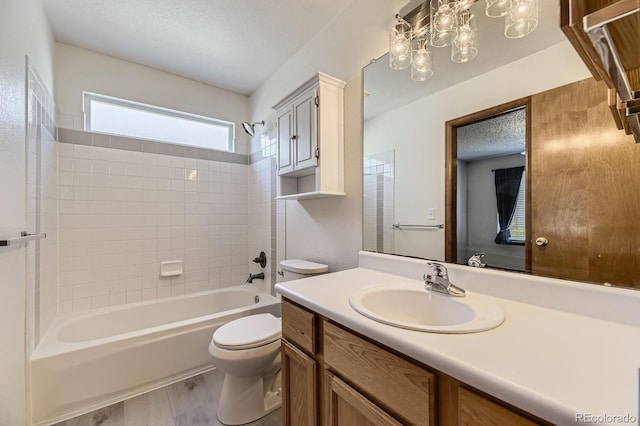17692 E Brown Cir, Aurora, CO 80013 - full bathroom featuring vanity, shower / washtub combination, a textured ceiling, and wood finished floors