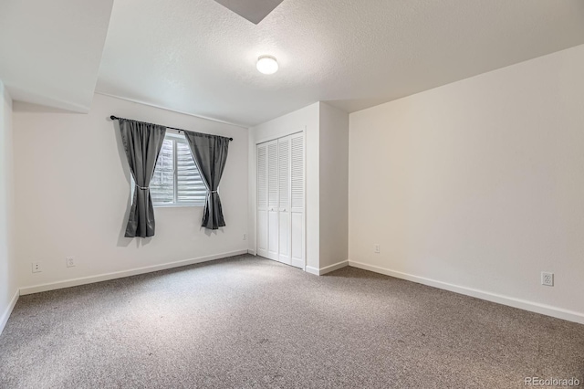 17692 E Brown Cir, Aurora, CO 80013 - unfurnished bedroom with carpet, a textured ceiling, and a closet