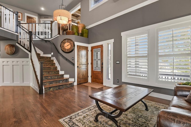 7243 S Kellerman Way, Aurora, CO 80016 - foyer entrance featuring wood finished floors, stairs, and a high ceiling