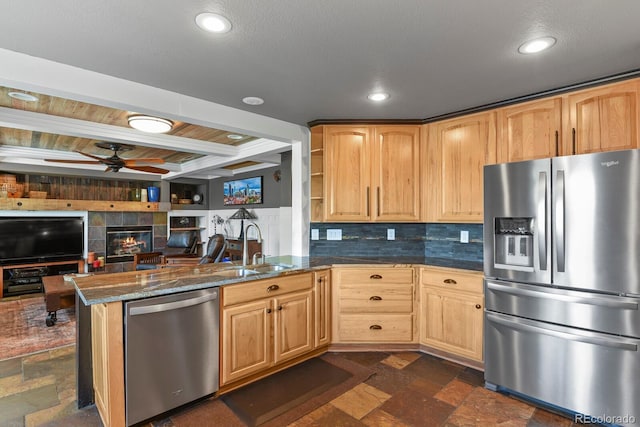 7243 S Kellerman Way, Aurora, CO 80016 - kitchen featuring stainless steel appliances, a sink, ceiling fan, stone tile floors, and recessed lighting