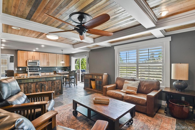 7243 S Kellerman Way, Aurora, CO 80016 - living area featuring a ceiling fan, beam ceiling, stone tile flooring, coffered ceiling, and wood ceiling