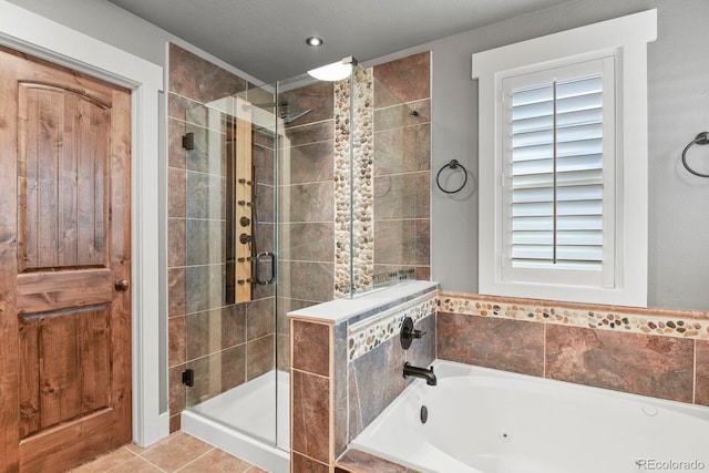 7243 S Kellerman Way, Aurora, CO 80016 - full bath featuring a shower stall, a garden tub, plenty of natural light, and tile patterned flooring