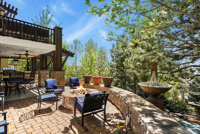 7243 S Kellerman Way, Aurora, CO 80016 - view of patio featuring a fire pit, a ceiling fan, and outdoor dining area