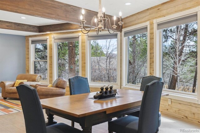 7317 Fremont Pl, Larkspur, CO 80118 - dining area featuring recessed lighting, a notable chandelier, wood finished floors, and beam ceiling