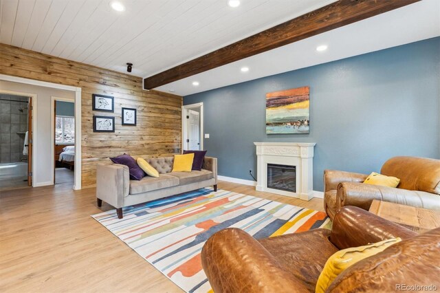 7317 Fremont Pl, Larkspur, CO 80118 - living room featuring wooden walls, baseboards, recessed lighting, and light wood-style floors