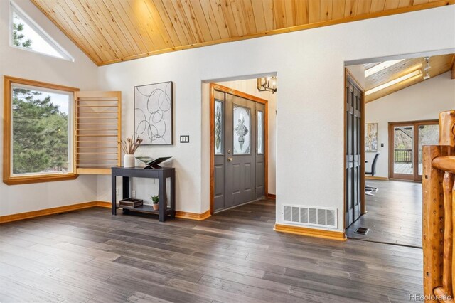 7317 Fremont Pl, Larkspur, CO 80118 - entrance foyer with wood ceiling, vaulted ceiling, dark wood-style flooring, and visible vents