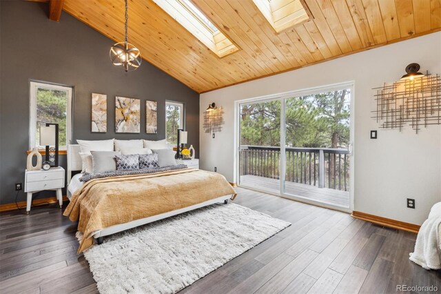7317 Fremont Pl, Larkspur, CO 80118 - bedroom with access to exterior, a skylight, baseboards, and multiple windows
