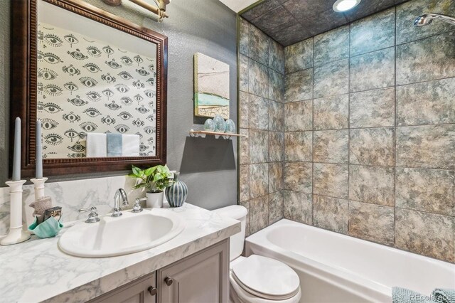 7317 Fremont Pl, Larkspur, CO 80118 - bathroom with toilet, vanity, and shower / bathing tub combination