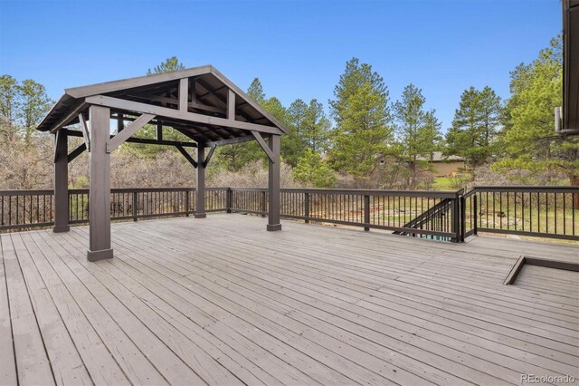 7317 Fremont Pl, Larkspur, CO 80118 - wooden terrace featuring a gazebo