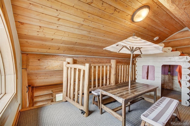 interior space featuring vaulted ceiling and wooden ceiling