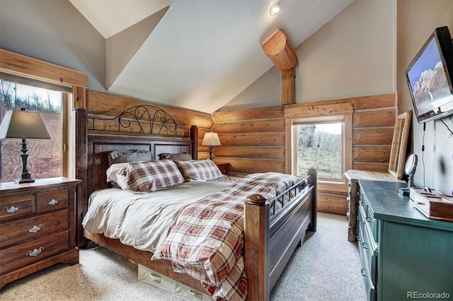 carpeted bedroom with log walls and high vaulted ceiling