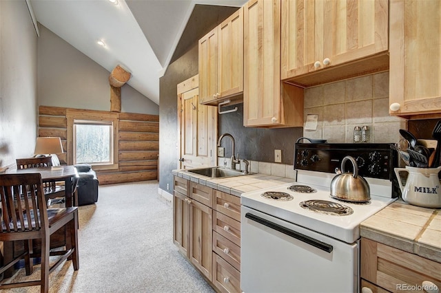 kitchen featuring light carpet, sink, tile counters, lofted ceiling, and white electric range oven