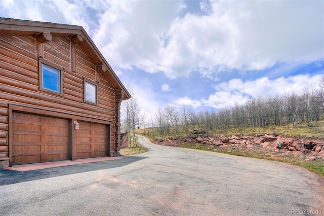 view of home's exterior with a garage