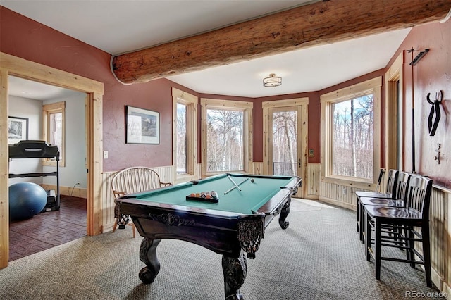 game room featuring pool table, beamed ceiling, and a wealth of natural light